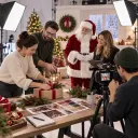 Marketing team planning a Santa brand message with event details and holiday sound cues