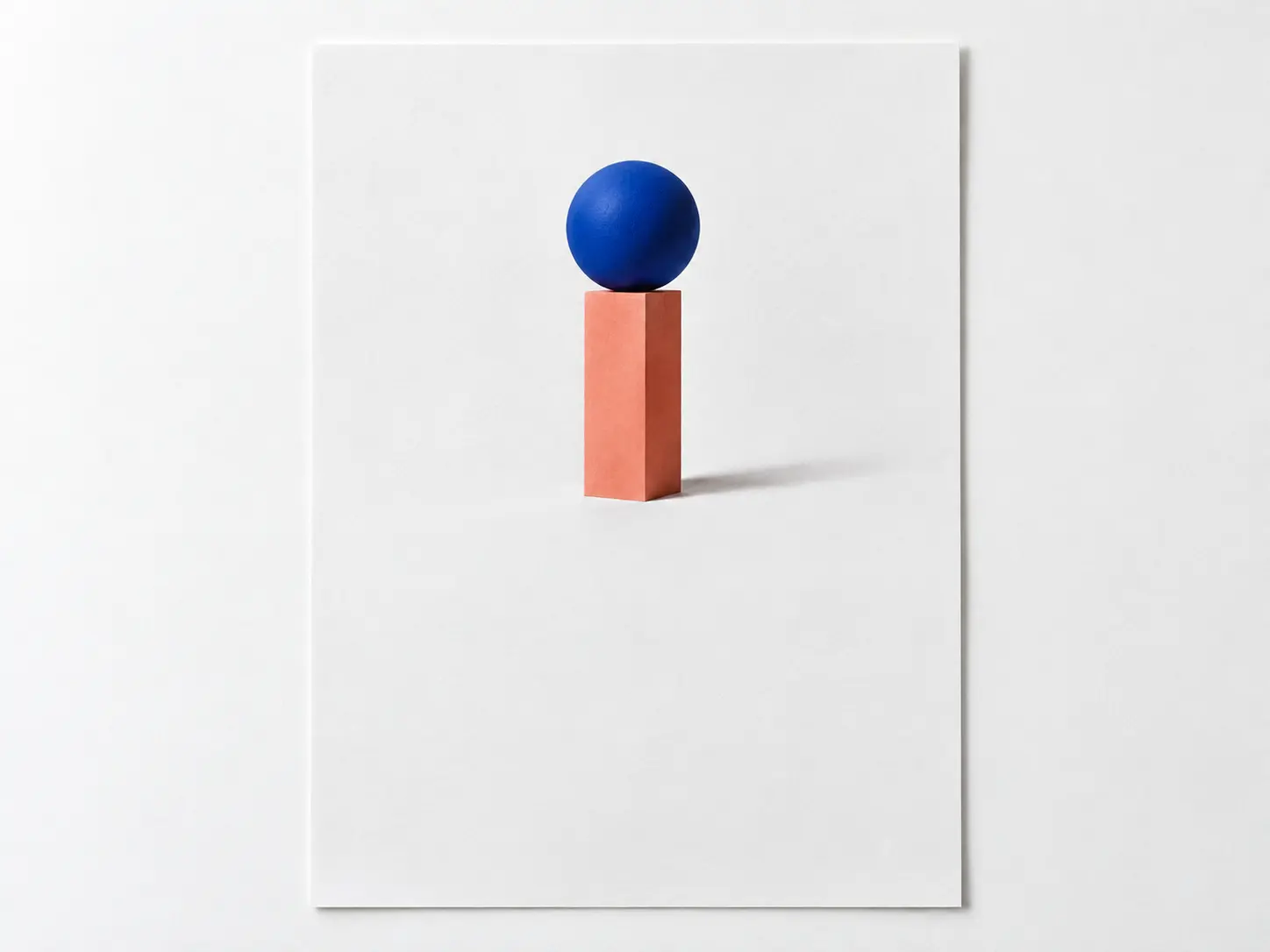 Minimal album poster composition with a small sculptural blue sphere, generous white margins, and open space below