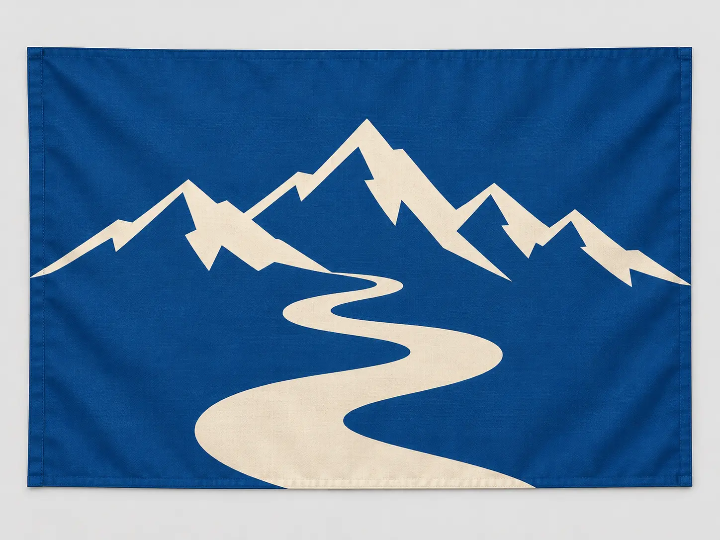 Original blue and cream mountain city-state flag with an angular mountain motif