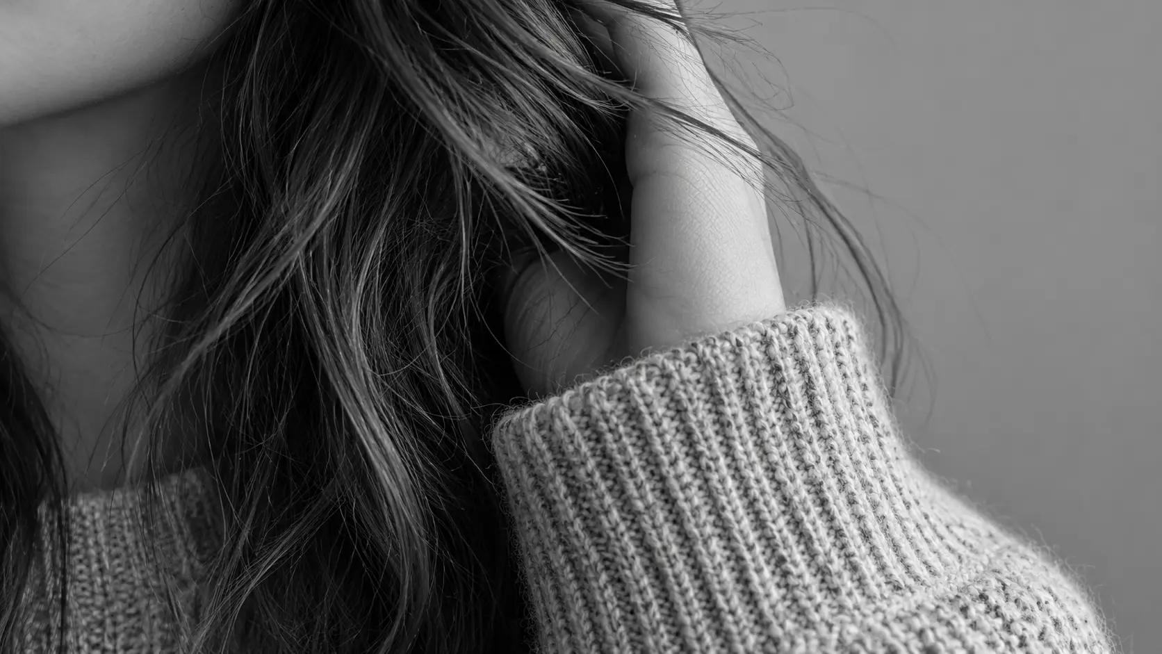 Close detail of hair and fabric texture kept sharp after the photo is turned black and white