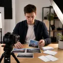 Independent creator arranging a complete news update from topic to final video