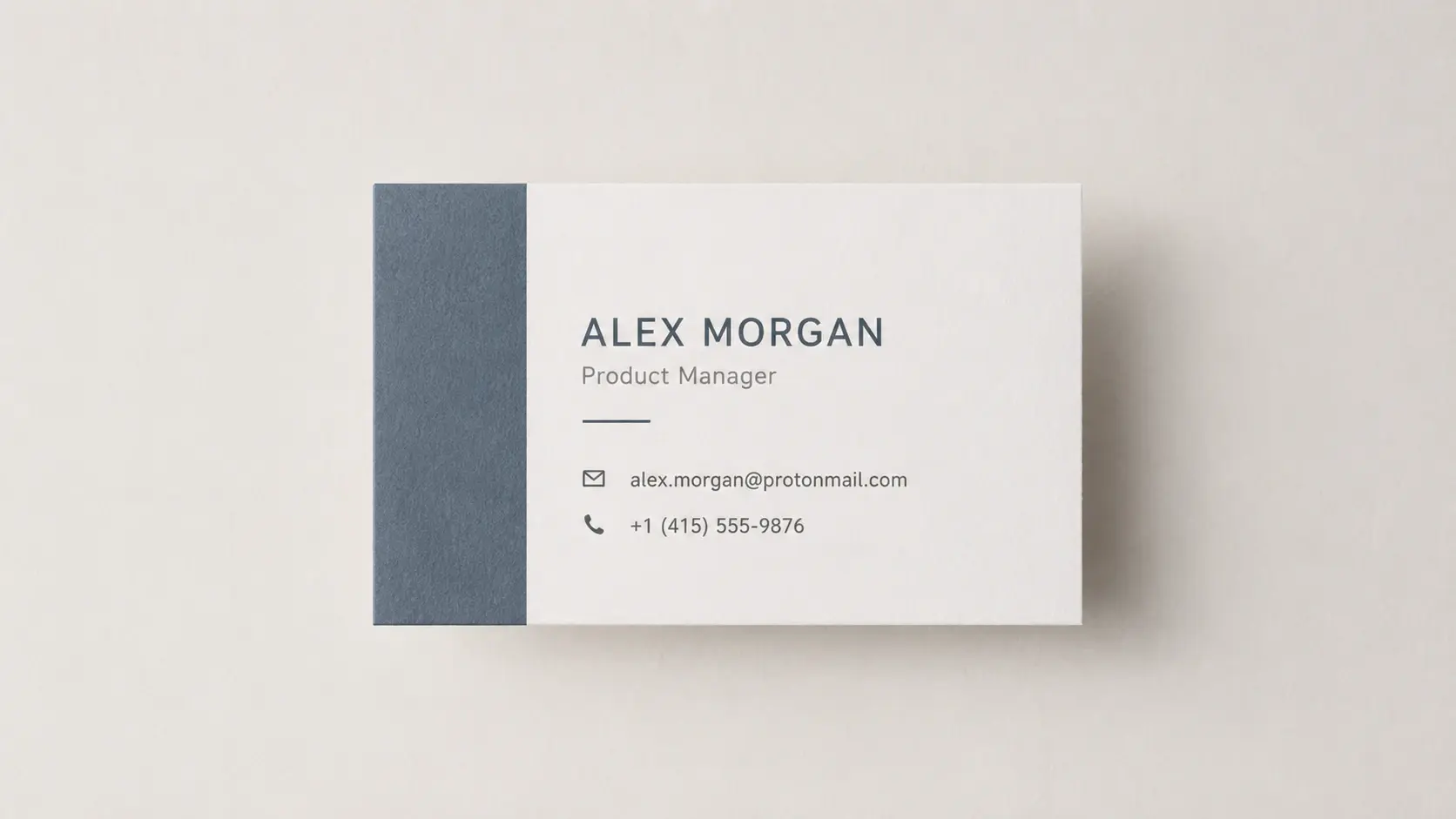 Close view of a business card design with legibly rendered name, title, email and phone