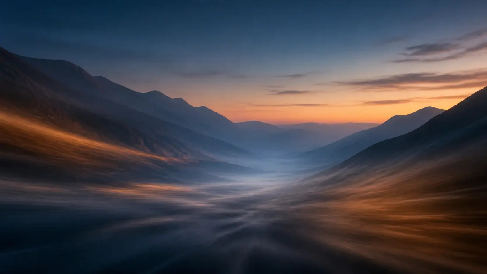 A still mountain valley at dusk dissolving into motion with a soft directional light trail sweeping across