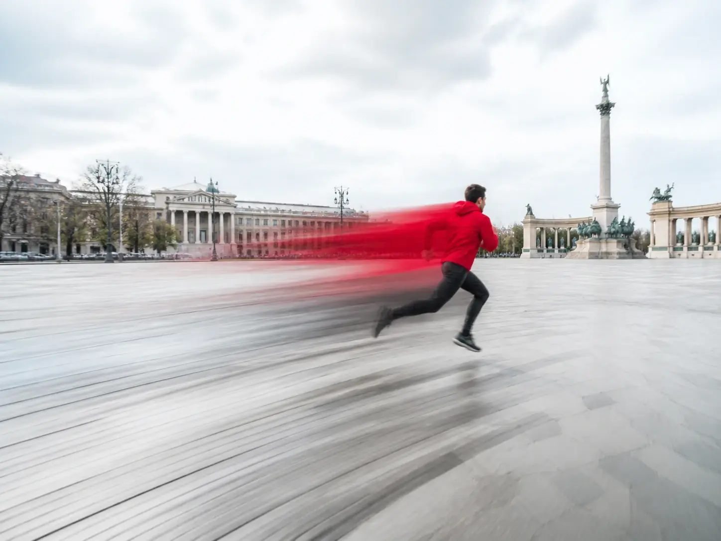 A running figure rendered with a motion blur effect showing directional speed streaks