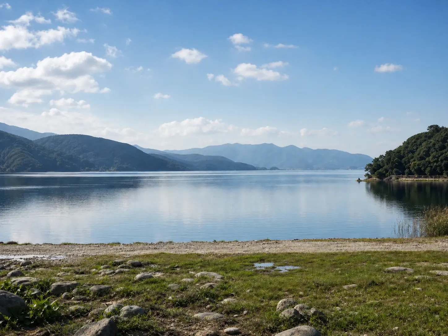 The same lakeside photo with the tourist and power lines erased and the background rebuilt