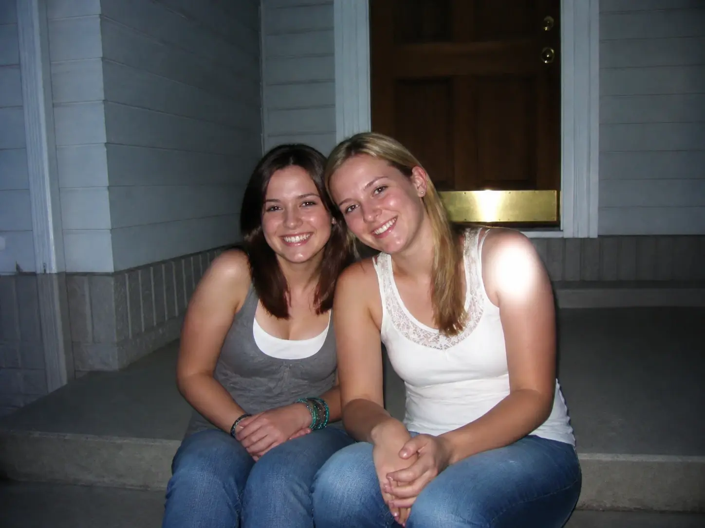 Two friends on a doorstep fully rendered in the early 2000s flash look with nothing else in the frame