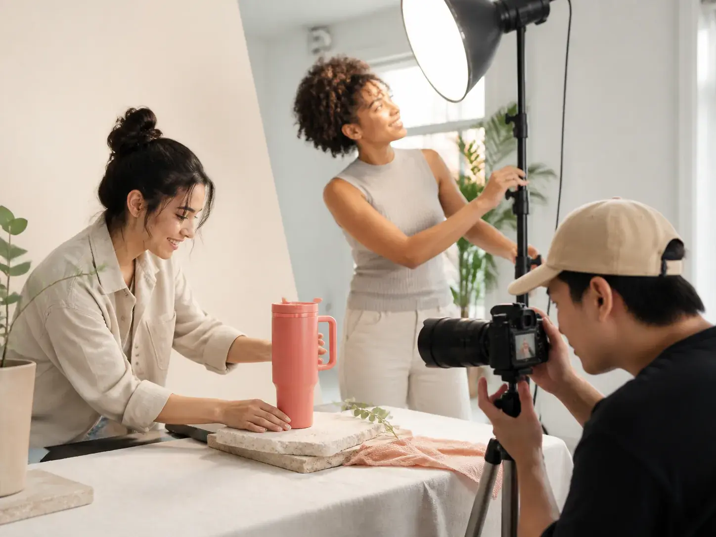 Brand team arranging product images, voiceover notes, and BGM for a promo video