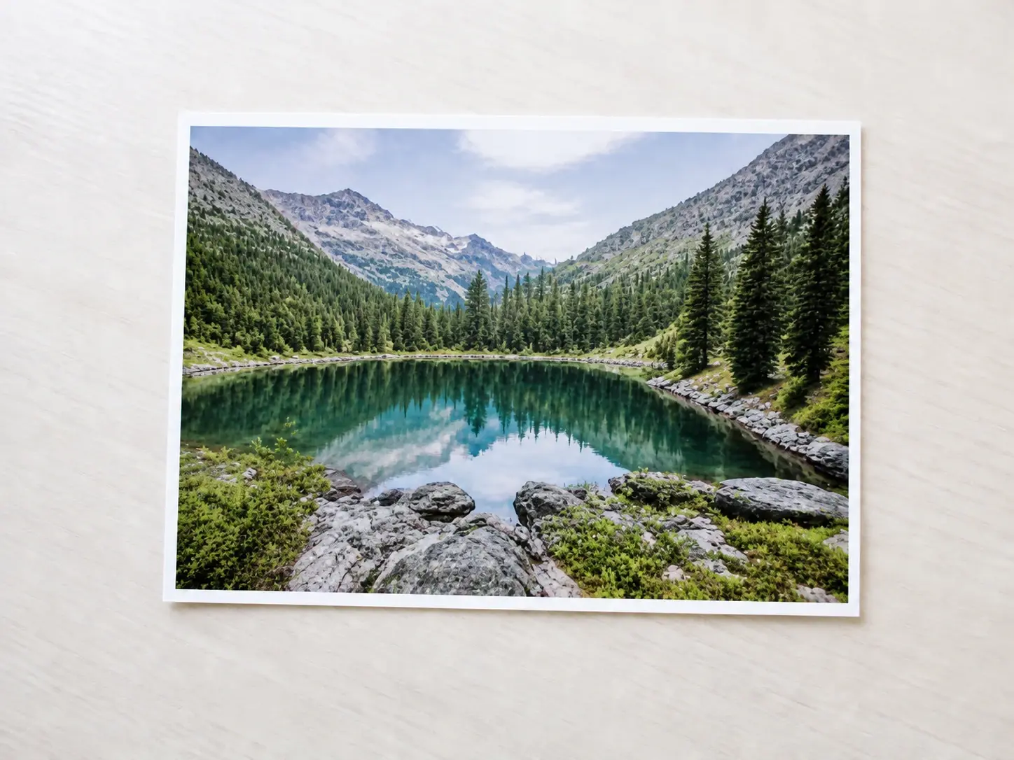 The same mountain lake photograph enlarged with crisp rebuilt edges and leaf detail
