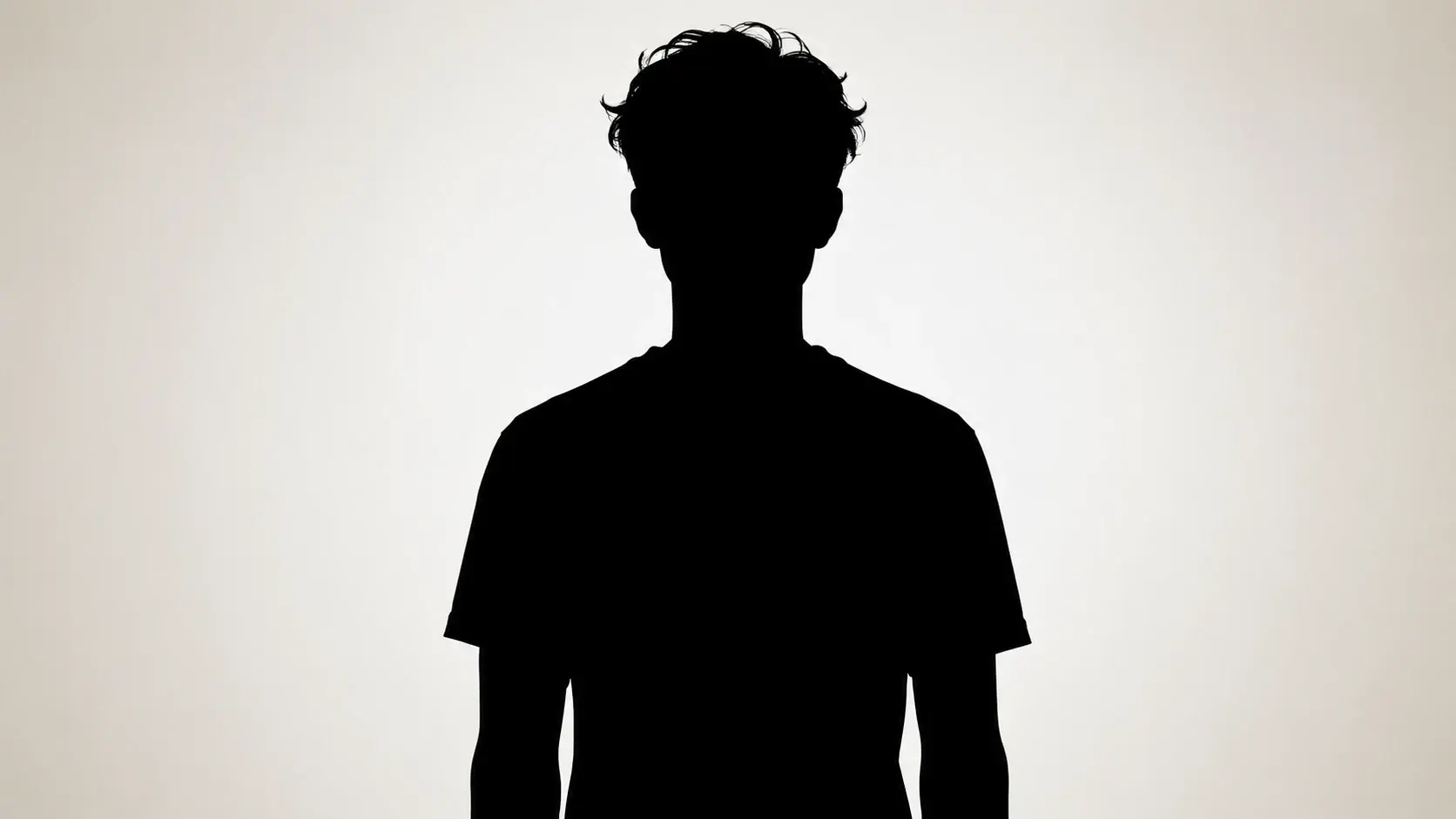 A portrait photo turned into a solid black silhouette with clean edges on a light background