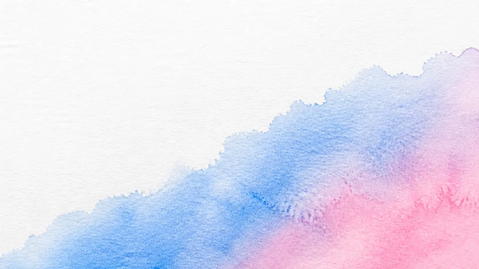 A wide watercolor wash spreading across damp cotton paper with pigment blooming at the edges